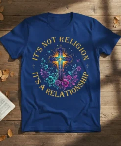 Christian t-shirt with the quote "It's Not Religion It's A Relationship" in yellow text surrounding a glowing cross and floral