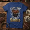 It's Not a Beard It's a Saddle t-shirt design featuring a cowboy saddle and beard graphic with western typography