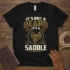 IT'S NOT A BEARD IT'S-A SADDLE text design with a vintage saddle graphic, perfect for cowboys and western wear enthusiasts