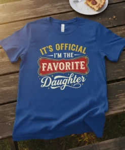 Blue t-shirt with yellow and red text stating "It's Official I'm The Favorite Daughter" in a vintage style