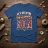 It's Official I'm The Favorite Son text design on a blue t-shirt with retro styling and star accents