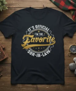 Black t-shirt with "IT'S OFFICIAL I'M THE Favorite SON-IN-LAW" text in gold and white vintage circular design