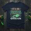 Dark navy t-shirt featuring the quote "IT'S OK I'M ON 500MG OF FUKITOL AND ON 300MG OF GOSUKADIK" with a