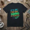 IT'S OK I'M ON 500MG OF FUKITOL text in colorful font with pill graphic on black t-shirt