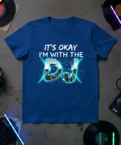 It's Okay I'm With The DJ text design on a blue t-shirt with futuristic cityscape graphic