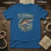 It's Salmon! text with a leaping salmon graphic and waves, printed on a blue t-shirt