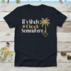 It's Shots Clock Somewhere t-shirt with a palm tree graphic and sun symbol