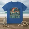 T-shirt with bold text "IT'S STILL THE GULF OF MEXICO PENDEJO" over a stylized wave and palm trees, vintage sunset