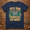 It's Too Peopley In Here quote with a grumpy cat illustration on a navy t-shirt