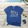 It's Vodka Clock Somewhere quote on a blue t-shirt with sun, palm tree, and cocktail graphics