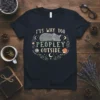 T-shirt with the text "IT'S WAY TOO PEOPLEY OUTSIDE" and a sleeping grey cat graphic, surrounded by floral elements and