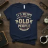It's Weird Being The Same Age As Old People Est. Yesterday quote on a navy t-shirt with vintage eagle graphics