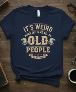 It's Weird Being The Same Age As Old People Est. Yesterday quote on a navy t-shirt with vintage eagle graphics