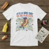 White t-shirt featuring "IT'S A BAD DAY TO BE A GLIZZY" text with a cartoon hot dog character running from