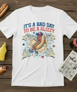 White t-shirt featuring "IT'S A BAD DAY TO BE A GLIZZY" text with a cartoon hot dog character running from