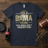 It's a Bama Thing You Wouldn't Understand text design on a navy t-shirt, featuring football imagery and college-style typography