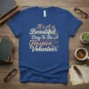 It's A Beautiful Day To Be A Hospice Volunteer quote on a blue t-shirt with floral and hand graphics