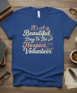 It's A Beautiful Day To Be A Hospice Volunteer quote on a blue t-shirt with floral and hand graphics