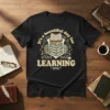T-shirt with "It's a beautiful day for LEARNING" text and stack of books graphic