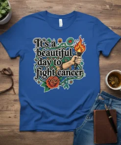 It's a beautiful day to fight Cancer text with a torch and rose graphic on a blue t-shirt