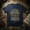 T-shirt with "IT'S A BOB BOB THING Edition YOU WOULDN'T UNDERSTAND" text in vintage gold and white distressed font, navy