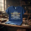 Blue t-shirt with gold text "It's A Brooks Family Thing You Wouldn't Understand" and wings graphic