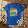 IT'S A GOOD DAY TO MAKE SOME ART quote on a blue t-shirt with colorful paint splatter graphic