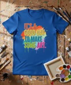 IT'S A GOOD DAY TO MAKE SOME ART quote on a blue t-shirt with colorful paint splatter graphic