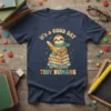 Teacher t-shirt design with text "It's a Good Day to Teach Tiny Humans" and a cute sloth holding a pencil