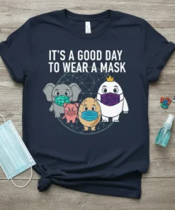 T-shirt with the text "It's A Good Day To Wear A Mask" and cartoon elephant, pig, egg, and bird wearing