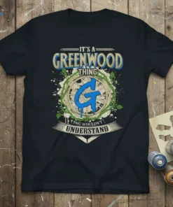 T-shirt with "IT'S A GREENWOOD THING YOU WOULDN'T UNDERSTAND" text and a large blue 'G' graphic