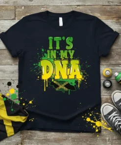 It's IN MY DNA text with Jamaican flag map graphic, green and yellow splatter design, on a navy t-shirt