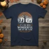 Halloween t-shirt with text "It's The Most Wonderful Time Of The Year" and a tree with witch, mummy, and ghost