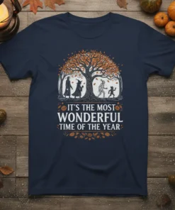 Halloween t-shirt with text "It's The Most Wonderful Time Of The Year" and a tree with witch, mummy, and ghost