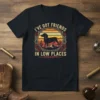 I've Got Friends In Low Places T-Shirt with dachshund silhouette, retro sunset, roses, and cacti design