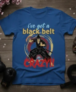 Blue t-shirt with "i've got a black belt in CRAZY!!" text and a martial artist in a black gi graphic