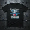 I've Survived too many storms TO BE BOTHRED BY raindrops. quote on a black t-shirt with a tornado and heart