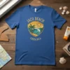 Jaco Beach Costa Rica graphic t-shirt featuring a shield design with palm trees, ocean waves, and sun
