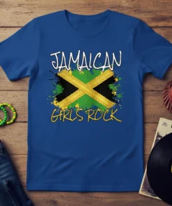 Royal blue t-shirt with "JAMAICAN GIRLS ROCK" text above a distressed Jamaican flag design, symbolizing pride and heritage