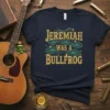 Jeremiah Was A Bullfrog quote on a navy t-shirt with lily pad graphics, vintage style