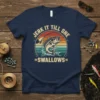 Jerk It Till She Swallows funny fishing t-shirt with a bass jumping out of water and retro sunset background