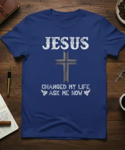 Christian t-shirt with "JESUS CHANGED MY LIFE ASK ME HOW" text and a golden cross with doves graphic