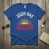 Jesus Has RIZZEN Christian T-Shirt with sun graphic, bold red text, and retro font