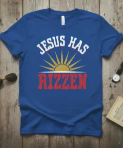 Jesus Has RIZZEN Christian T-Shirt with sun graphic, bold red text, and retro font
