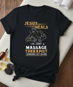 Black t-shirt with "Jesus Heals I'm Just a Massage Therapist Lending My Hand" text and a graphic of a person