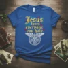 Blue T-Shirt with "Jesus loves everyone you hate" quote in gothic font and a cross with wings emblem