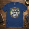 Jesus Loves Me text design with doves, crosses, and grapevines on a navy t-shirt