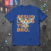 Blue t-shirt with bold orange text reading "JESUS LOVES YOU BRO." and abstract light blue graphics