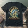 Christian t-shirt with full quote "Jesus Made Me A Fisher Of Man" and fishing graphic, featuring a jumping fish and