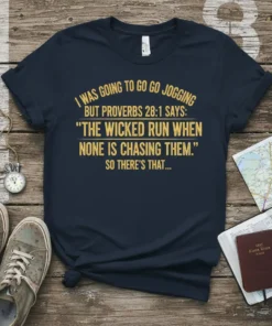 Navy blue t-shirt with gold text: "I WAS GOING TO GO GO JOGGING BUT PROVERBS 28:1 SAYS: 'THE WICKED RUN